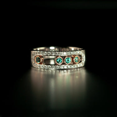 0.22ct natural alexandrite and diamond ring in 18k white and rose gold with moving bezel design